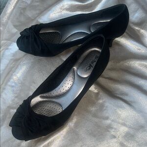 Coach and Four Black Low Heels with Elegant Design